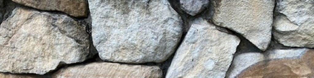 Stone walls on the Sunshine Coast are increasing in popularity as a type of retaining wall.